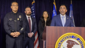 United States Attorney Martin Estrada, at podium, is joined by Los Angeles Police Chief Dominic Choi, far left, and other officials to announce court filings related to the death of actor Matthew Perry in Los Angeles on Thursday, Aug. 15, 2024. (AP Photo/Damian Dovarganes)