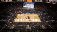 FILE - Empty seats are seen at the Scotiabank Arena as Toronto Raptors take on Golden State Warriors in NBA basketball action in Toronto on Saturday, December 18, 2021. THE CANADIAN PRESS/Chris Young