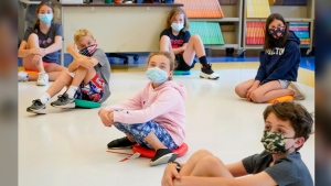 FILE - Fifth graders wearing face masks are seated at proper social distancing during a music class at the Milton Elementary School in Rye, N.Y., May 18, 2021. (AP Photo/Mary Altaffer, File)