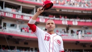 Cincinnati Reds' Joey Votto acknowledges the crowd as he walks off the field after a baseball game against the Pittsburgh Pirates in Cincinnati, Sunday, Sept. 24, 2023. (AP Photo/Aaron Doster)