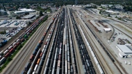 Rail and tanker cars and shipping containers sit idle at the Canadian Pacific Kansas City (CPKC) rail yard in Port Coquitlam, B.C., Monday, Aug. 19, 2024. THE CANADIAN PRESS/Darryl Dyck