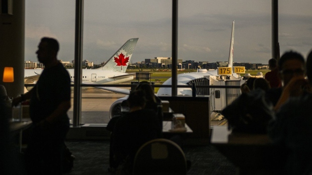 An Air Canada Plane is seen at Pearson Airport in Toronto, on Wednesday, July 24, 2024. THE CANADIAN PRESS/Christopher Katsarov