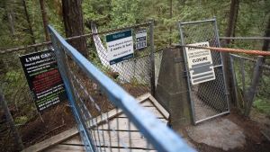 A 17-year-old from Ontario is dead after climbing over a fence and falling off the edge of a cliff in a popular park in North Vancouver, B.C. Fences block the access to the Lynn Suspension Bridge in North Vancouver, B.C., Monday, Sept. 21, 2020. THE CANADIAN PRESS/Jonathan Hayward