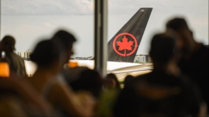 An Air Canada plane is seen at Pearson Airport in Toronto, Wednesday, July 24, 2024. THE CANADIAN PRESS/Christopher Katsarov