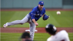 Toronto Blue Jays pitcher Yariel Rodríguez watches Boston Red Sox's Jarren Duran (16) drive a home run ball during the first inning of a baseball game at Fenway Park, Tuesday, Aug. 27, 2024, in Boston. (AP Photo/Charles Krupa)