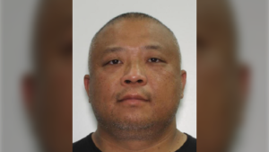 Police say 47-year-old Zhixiong Marko Hu is now wanted for first-degree murder in Mui's death. (YRP)