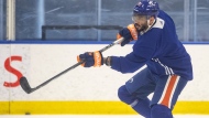 Edmonton Oilers forward Evander Kane posted a video on social media Wednesday, alleging that a man spat on his car and used racist language toward him. Kane (91) takes a shot during practice in Edmonton on Thursday June 20, 2024. THE CANADIAN PRESS/Jason Franson