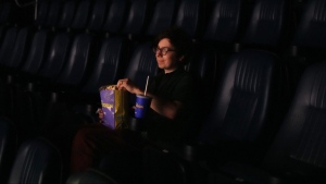 Eric Tisch of Reel Canada, who is attempting a world record for most films watched at a film festival this TIFF, sits in an auditorium at the Scotiabank Theatre, in Toronto, Thursday, Aug. 29, 2024. (The Canadian Press/Chris Young)