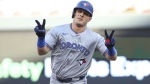 Toronto Blue Jays' Daulton Varsho celebrates his two-run home run while he runs the bases during the first inning of a baseball game against the Minnesota Twins, Saturday, Aug. 31, 2024, in Minneapolis. (AP Photo/Matt Krohn)