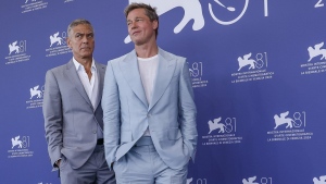 George Clooney, left, and Brad Pitt pose for photographers at the photo call for the film 'Wolfs' during the 81st edition of the Venice Film Festival in Venice, Italy, on Sunday, Sept. 1, 2024. (Photo by Joel C Ryan/Invision/AP)