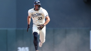 Minnesota Twins' Royce Lewis runs toward third base on an error by Toronto Blue Jays third baseman Luis De Los Santos during the seventh inning of a baseball game, Sunday, Sept. 1, 2024, in Minneapolis. (AP Photo/Matt Krohn)