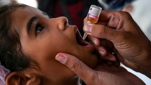 A health worker administers a polio vaccine to a child at a hospital in Deir al-Balah, central Gaza Strip, on Sept. 1, 2024. (Abdel Kareem Hana / AP Photo)