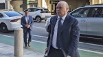 British tech magnate Mike Lynch walks into federal court in San Francisco, March 26, 2024, (AP Photo/Michael Liedtke)