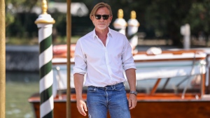 Daniel Craig poses for photographers upon arrival for the press conference of the film 'Queer' during the 81st edition of the Venice Film Festival in Venice, Italy, on Tuesday, Sept. 3, 2024. (Photo by Vianney Le Caer/Invision/AP) 