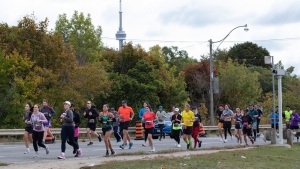 Runners are still looking to buy bibs to the sold-out marathons, and some are getting cheated by fraudsters. Runners participate in the Toronto Waterfront Marathon in Toronto, Sunday, Oct. 15, 2023. THE CANADIAN PRESS/Jessica Lee