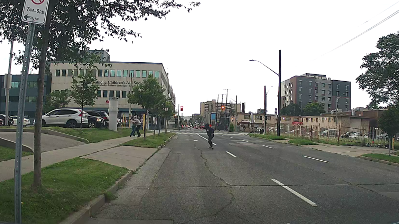 A still from a dashcam footage shows two men exchanging fires during a shootout in Hamilton on Saturday, Aug. 10, 2024. (Hamilton Police Service)