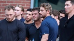 Columbus Blue Jackets player Cole Sillinger, center, reacts during the candlelight vigil to honor Columbus Blue Jackets hockey player Johnny Gaudreau, Thursday, Sept. 4, 2024, outside of Nationwide Arena in Columbus, Ohio. Gaudreau and his brother Matthew were killed by a motor vehicle last week while riding bicycles. (AP Photo/Joe Maiorana)