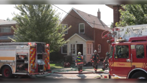 Firefighters are shown battling a two-alarm blaze at an Etobicoke home on Thursday, Sept. 5.