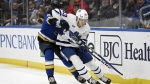 Toronto Maple Leafs' Marshall Rifai (83) works the puck against St. Louis Blues' Jake Neighbours (63) during the second period of an NHL hockey game Monday, Feb. 19, 2024, in St. Louis. The Maple Leafs have signed defenceman Rifai to a two-year contract extension, the club announced Thursday. THE CANADIAN PRESS/AP/Michael Thomas