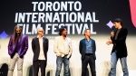 Prime Minister Justin Trudeau greets members of the Tragically Hip (from left): Rob Baker, Johnny Fay, Paul Langlois, and Gord Sinclair, following the screening of the documentary "The Tragically Hip: No Dress Rehearsal", at the 2024 Toronto International Film Festival, in Toronto on Thursday, September 5, 2024. THE CANADIAN PRESS/Christopher Katsarov