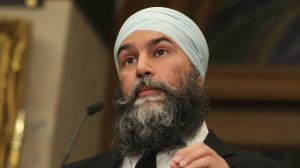 New Democratic Party Leader Jagmeet Singh speaks in the Foyer of the House of Commons about the NSICOP report, on Parliament Hill in Ottawa, on Thursday, June 13, 2024. THE CANADIAN PRESS/Patrick Doyle 