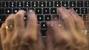 A man uses a computer keyboard in Toronto in this Sunday, Oct. 9, 2023 photo illustration. THE CANADIAN PRESS/Graeme Roy