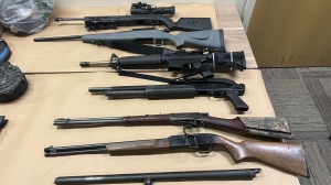 This photo provided by the Monterey County Sheriff's Office on Friday, Sept. 6, 2024, shows some of the weapons confiscated from the Prunedale, Calif., home of Vicente Arroyo, suspected killing dozens of animals. (Monterey County Sheriff's Office via AP) 