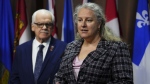 Jennifer Carr, PIPSC President, speaks as Chris Aylward, PSAC National President looks on during a press conference on Parliament Hill in Ottawa on Tuesday, Feb. 27, 2024., On Monday, federal public servants will return to the office a minimum of three days a week. THE CANADIAN PRESS/Sean Kilpatrick