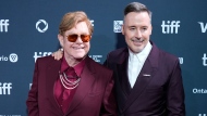 Elton John, left, and David Furnish attend the premiere of "Elton John: Never Too Late" during the Toronto International Film Festival on Friday, Sept. 6, 2024, at Roy Thomson Hall in Toronto. (AP Photo/Chris Pizzello)