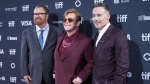 R. J. Cutler, from left, Elton John, and David Furnish attend the premiere of "Elton John: Never Too Late" during the Toronto International Film Festival on Friday, Sept. 6, 2024, at Roy Thomson Hall in Toronto. (AP Photo/Chris Pizzello)
