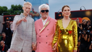 Tilda Swinton, from left, director Pedro Almodovar, and Julianne Moore pose for photographers upon arrival for the premiere of the film 'The Room Next Door' during the 81st edition of the Venice Film Festival in Venice, Italy, on Monday, Sept. 2, 2024. (Photo by Joel C Ryan/Invision/AP)