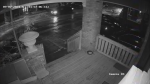 A still from a video released by Hamilton police shows a person firing a gun on a sidewalk. (Hamilton police)