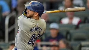 Toronto Blue Jays' Spencer Horwitz (48) hits a solo homer in the first inning of a baseball game against the Atlanta Braves, Saturday, Sept. 7, 2024, in Atlanta. (AP Photo/Mike Stewart)