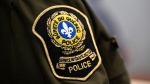 The Surete du Quebec, or Quebec Provincial Police patch is shown at a news conference in Quebec City on February 29, 2024. THE CANADIAN PRESS/Jacques Boissinot