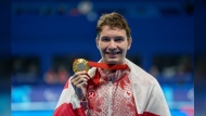 Canada's Nicholas Bennett poses with his gold medal after winning the men's 200 m. Individual medley SM14 at the 2024 Paralympics, Wednesday, Sept. 4, 2024, in Paris, France. THE CANADIAN PRESS/AP-Aurelien Morissard