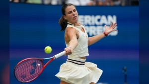 FILE - Emma Navarro, of the United States, returns a shot to Coco Gauff, of the United States, during the fourth round of the U.S. Open tennis championships, Sept. 1, in New York. 2024. (AP Photo/Pamela Smith, File)