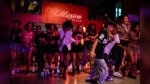 Youths dance to K-pop, popular Korean music, at a cultural house in Havana, Cuba, Saturday, Sept. 7, 2024. (AP Photo/Ramon Espinosa)