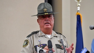 Laurel County sheriff John Root gives an update at the London Community Center in London, Ky., Sunday, Sept. 8, 2024, on the efforts to find the suspect in the Saturday shooting at Interstate 75 near Livingston, Ky. (AP Photo/Timothy D. Easley)
