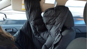 A driver used an empty coat to simulate a passenger so she could use the high-occupancy vehicle (HOV) lane during rush-hour on the QEW, Ontario police say. (X/@OPP_HSD)