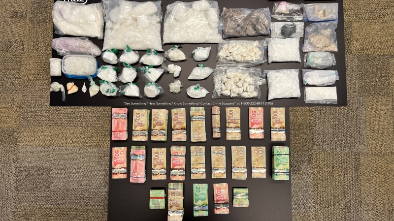 A cache of illicit substances and cash allegedly seized by Toronto-area police last week are seen in this image. (Halton Regional Police Service)