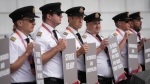 Air Canada pilots hold signs during an informational picket at Vancouver International Airport in Richmond, B.C., on Aug. 27, 2024. (Darryl Dyck / The Canadian Press)