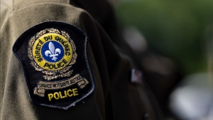 Quebec provincial police say the worst was avoided after a plane crash Sunday in the Laurentians region north of Montreal. A Quebec provincial police emblem is seen on an officer’s uniform in Montreal, Tuesday, Aug. 22, 2023. THE CANADIAN PRESS/Christinne Muschi