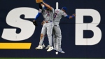 New York Mets, from left, Brandon Nimmo (9), Tyrone Taylor (15) and Starling Marte (6) celebrate their team's victory over the Toronto Blue Jays during MLB baseball action in Toronto on Monday Sept. 9, 2024. THE CANADIAN PRESS/Jon Blacker