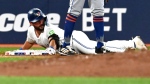 Toronto Blue Jays second baseman Davis Schneider (36) slides safely into third base with a triple against the New York Mets during fourth inning MLB baseball action in Toronto on Tuesday Sept. 10, 2024. THE CANADIAN PRESS/Jon Blacker