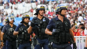 Police are seen near the pitch during a men's semifinal soccer match between Morocco and Spain at the 2024 Summer Olympics, Monday, Aug. 5, 2024, at Marseille Stadium in Marseille, France. Spain won 2-1. (AP Photo/Julio Cortez, File)