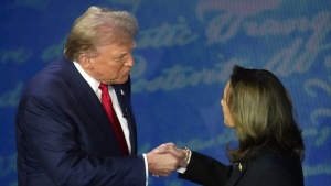 Republican presidential nominee former U.S. president Donald Trump shakes hands with Democratic presidential nominee U.S. Vice President Kamala Harris during an ABC News presidential debate at the National Constitution Center, Tuesday, Sept.10, 2024, in Philadelphia. (AP Photo/Alex Brandon)