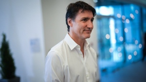 Prime Minister Justin Trudeau walks to a meeting room after speaking to reporters at the Liberal caucus retreat in Nanaimo, B.C., on Wednesday, September 11, 2024. THE CANADIAN PRESS/Darryl Dyck