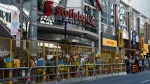 People protest outside of Scotiabank Theatre about the documentary "Russians at War" playing at the Toronto International Film Festival, in Toronto, on Tuesday Sept. 10, 2024. THE CANADIAN PRESS/Paige Taylor White