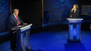 Kamala Harris listens as Donald Trump speaks during the ABC presidential debate in Philadelphia on Tuesday, Sept. 10. (Saul Loeb / AFP)