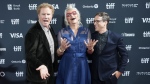 Will Ferrell, left, Harper Steele, centre, and director Josh Greenbaum pose for photographs on the red carpet for the film 'Will & Harper' during the Toronto International Film Festival, in Toronto, Wednesday, Sept. 11, 2024. (THE CANADIAN PRESS/Nathan Denette)